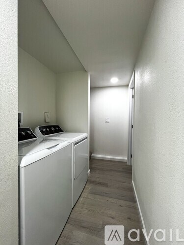 A laundry room with a washer and dryer.