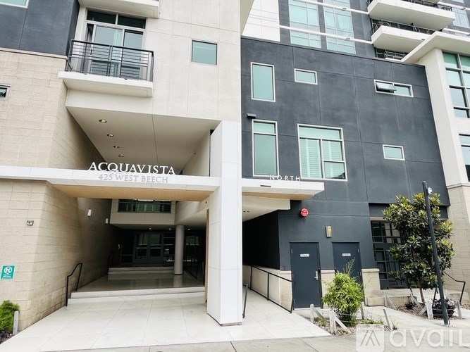 The front of a building with the name "ACQUAVISTA" on it.