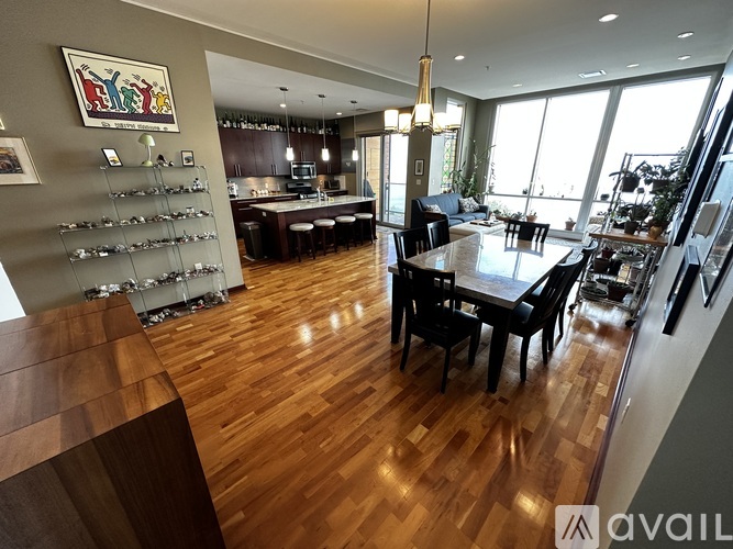 A modern kitchen with a dining table and chairs.