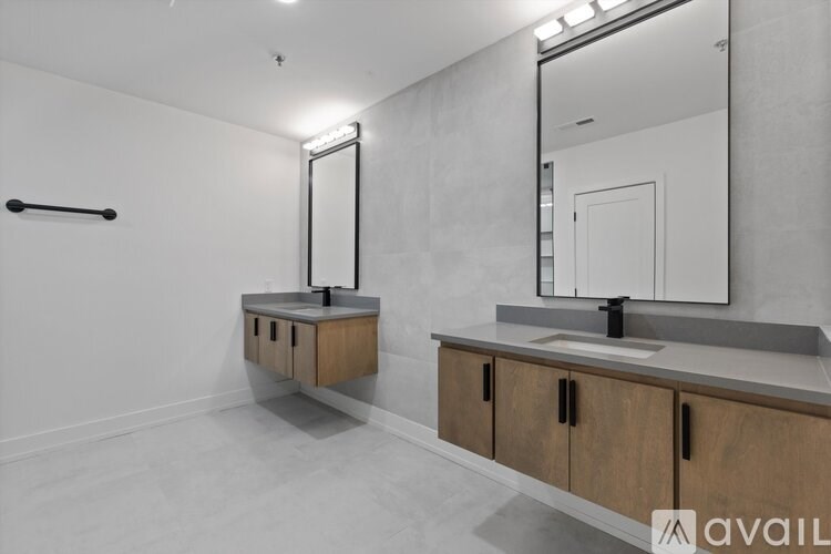 A bathroom with a vanity and a mirror.