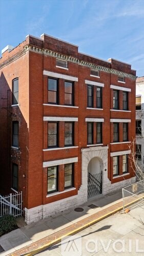 A red brick building with white trim and windows.