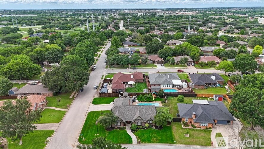 A suburban neighborhood with houses and trees.