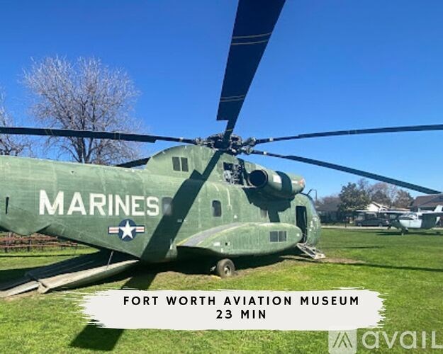A green helicopter with the word Marines written on it.