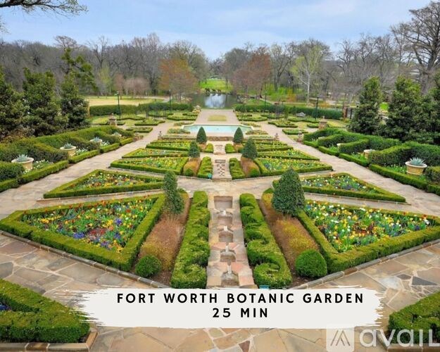 A beautifully landscaped garden with a fountain in the middle and a sign that says "Fort Worth Botanic Garden 25 min".