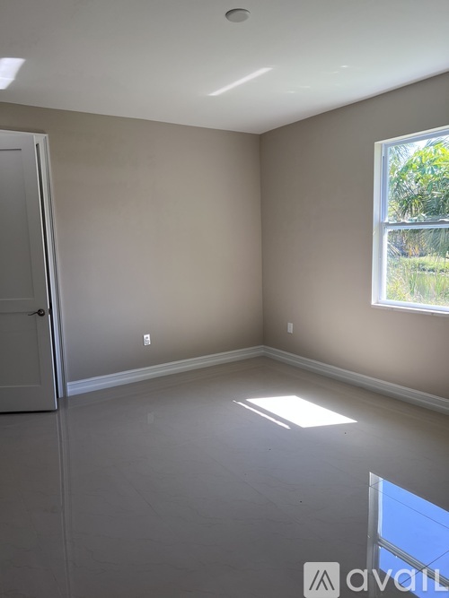 A room with a door and a window.