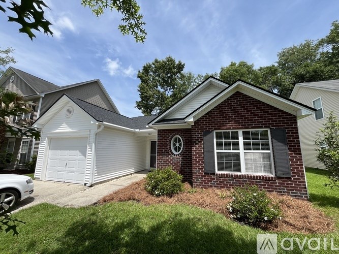 A house with a white garage door is for sale.