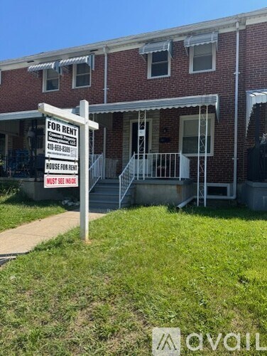 A house is for rent and the sign requests to see the house.