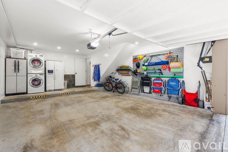 A garage with a mural on the wall and a bicycle.