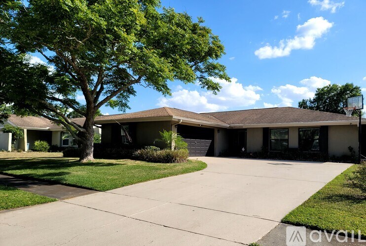A house with a tree in front of it.