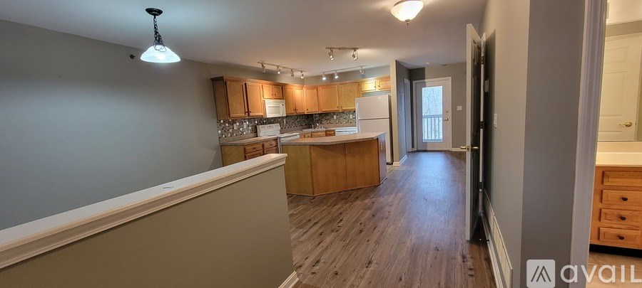 A kitchen with wooden cabinets and a countertop.