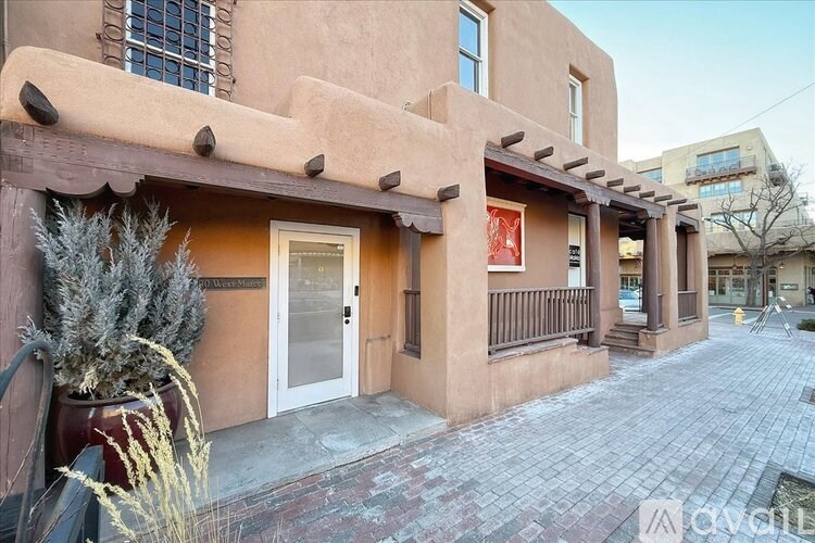 A building with a red sign on the door.