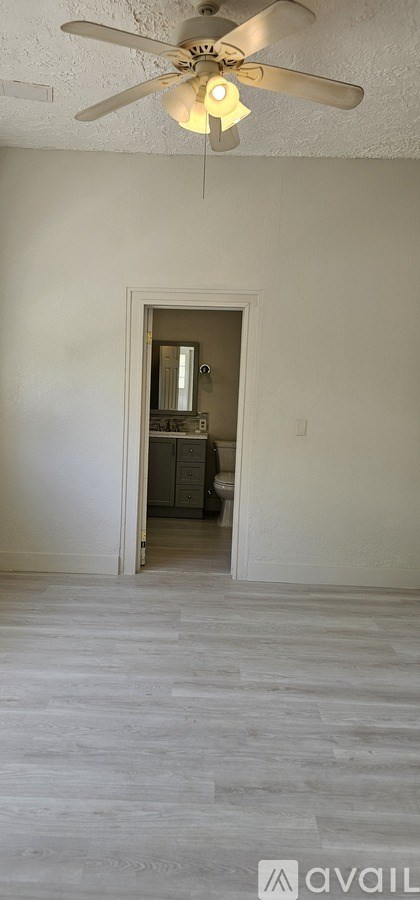 A kitchen with white cabinets and a counter.