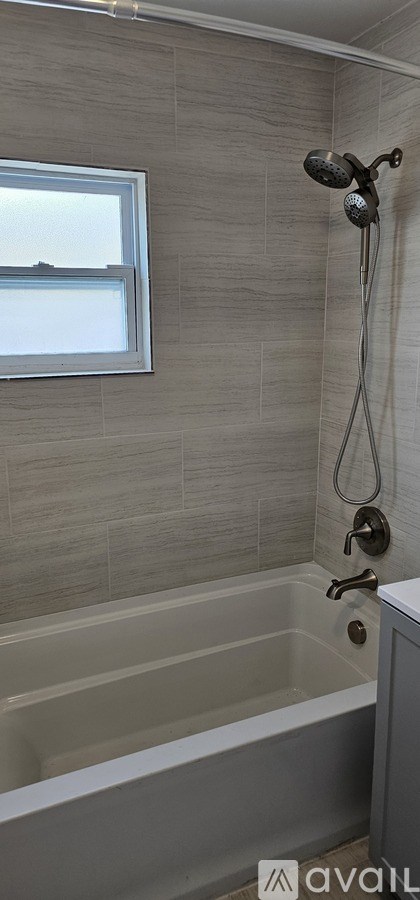 A room with white doors and a tiled floor.