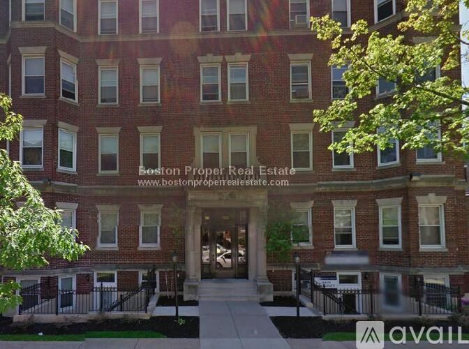 A building with the text "Boston Proper Real Estate" on it.