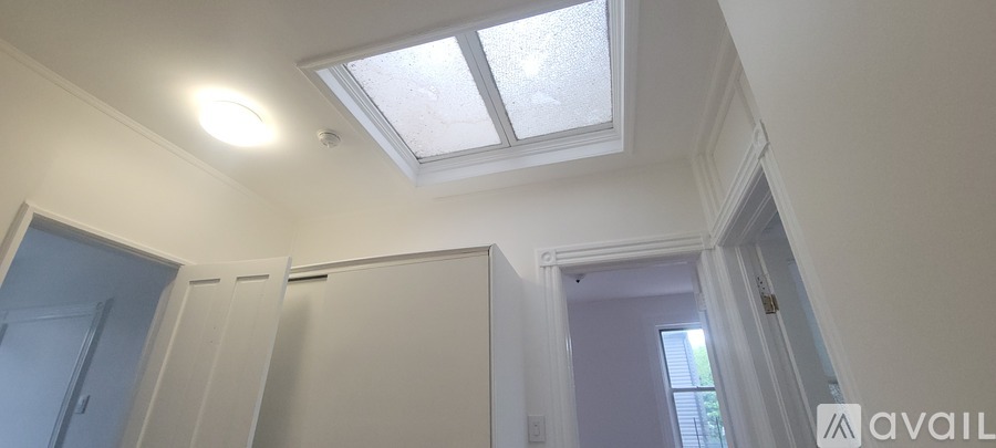 A room with a grey floor and white walls.