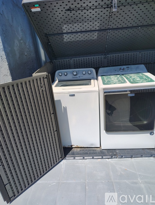A white dishwasher and oven are stacked on top of each other.