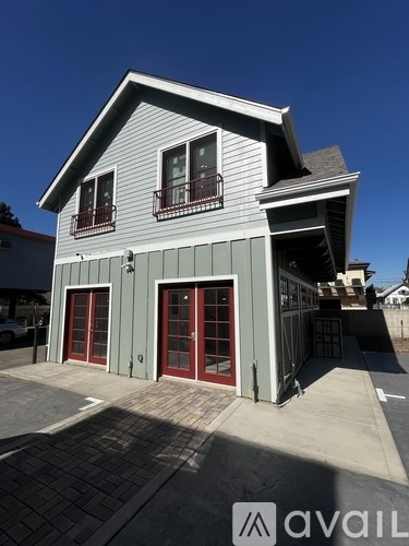 A two-story house with a garage on the ground floor.
