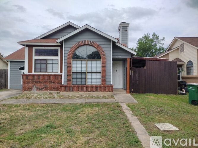 A house with a brick arched window is for sale.