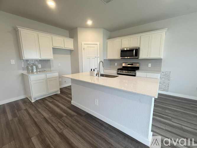 A two-story house with a garage is for sale.