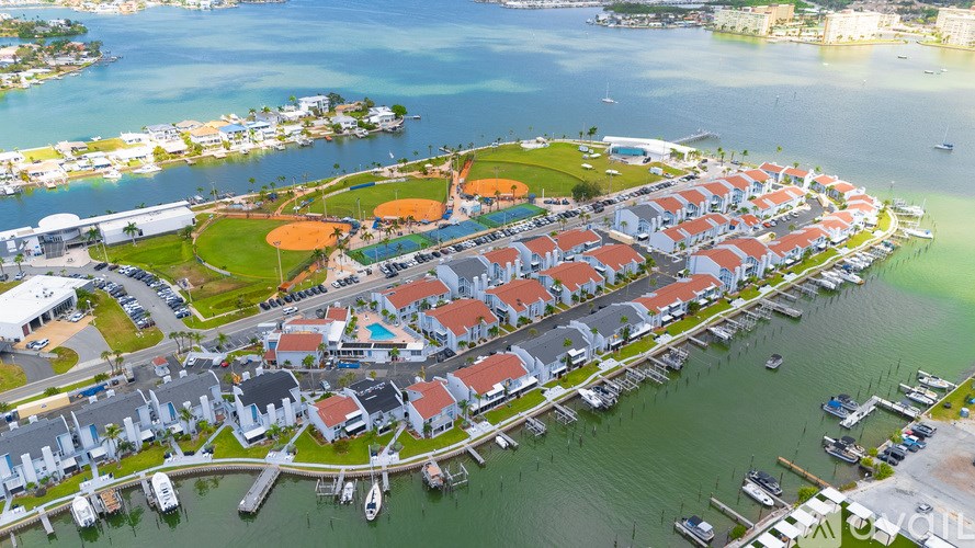 A small island with a marina and houses.