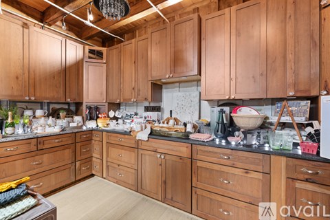 A kitchen with wooden cabinets and counters is shown.