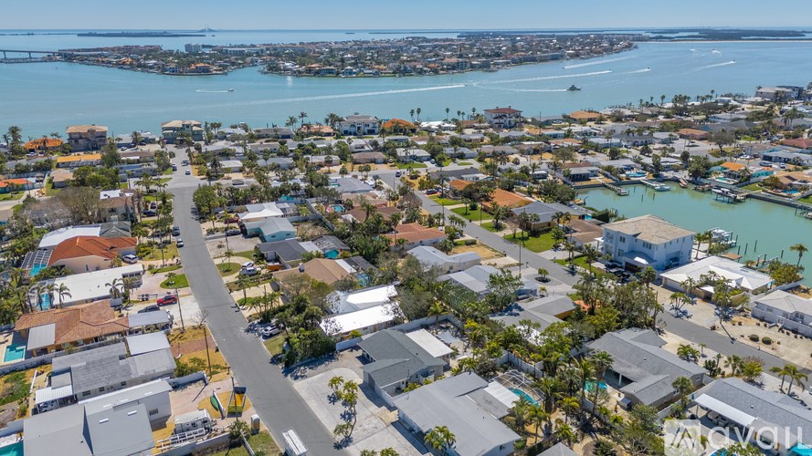 A bird's eye view of a residential area with a road running through it.