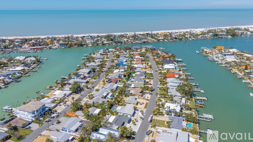 A bird's eye view of a residential area with a marina.