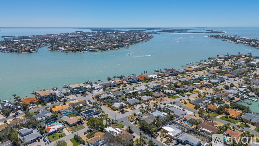 A bird's eye view of a residential area with houses and roads.