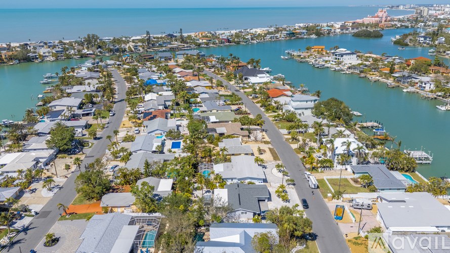 A bird's eye view of a residential area with houses and roads.