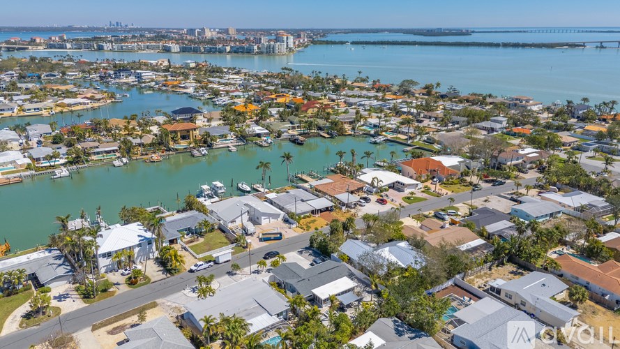 A bird's eye view of a residential area with houses and boats.