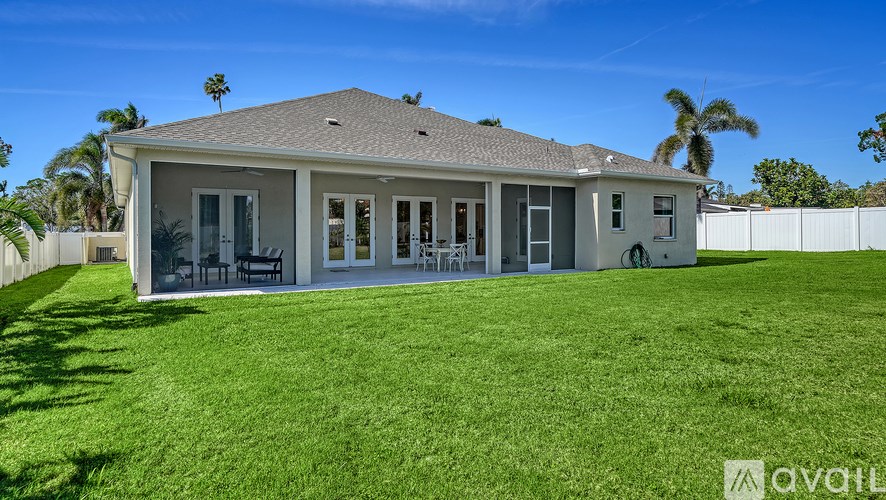 A house with a lawn in front of it is for sale.
