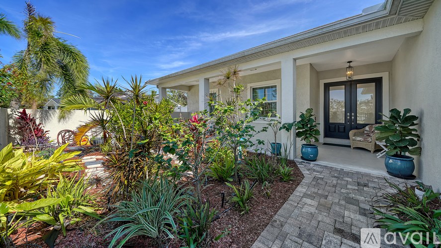 A house with a garden in front of it.