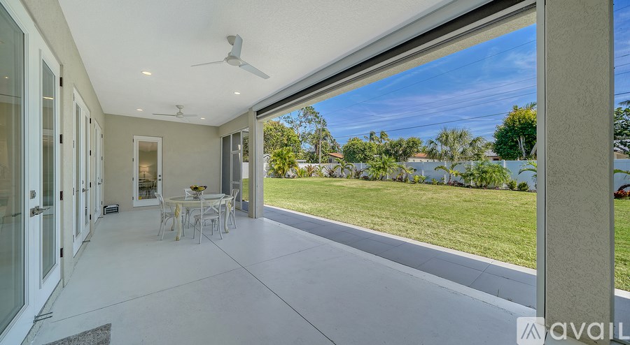 A patio with a table and chairs is available for rent.