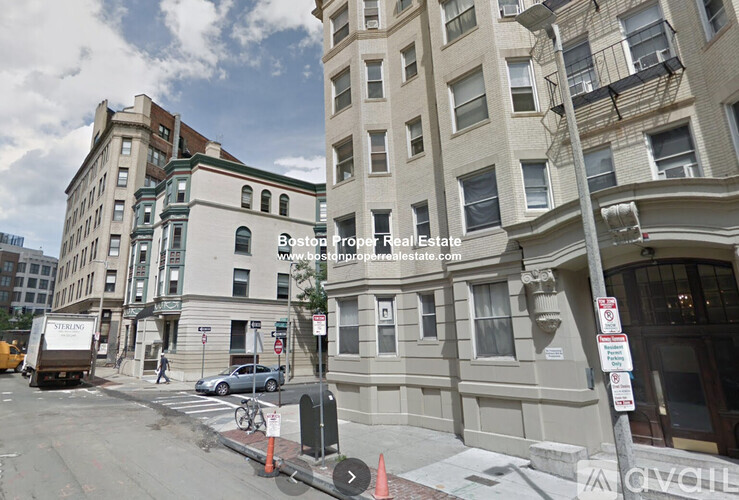 A street view of a building with a sign for Boston Property Real Estate.