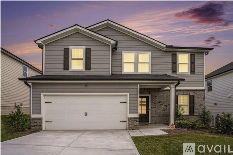A modern house with a garage is available for sale.