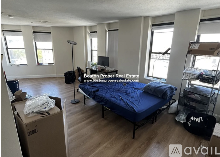 A room with a bed, a desk, and a chair is for sale.