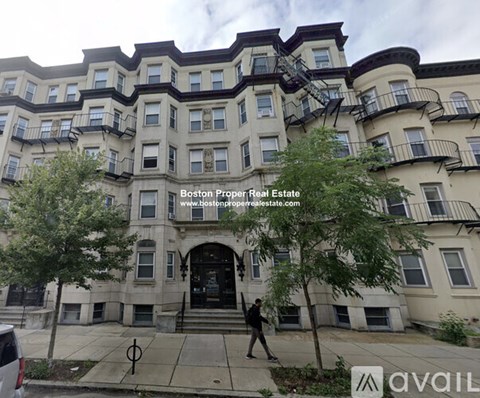 A building with the text "Boston Proper Real Estate" on it.