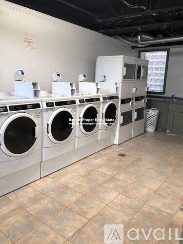 A row of washing machines in a laundromat.