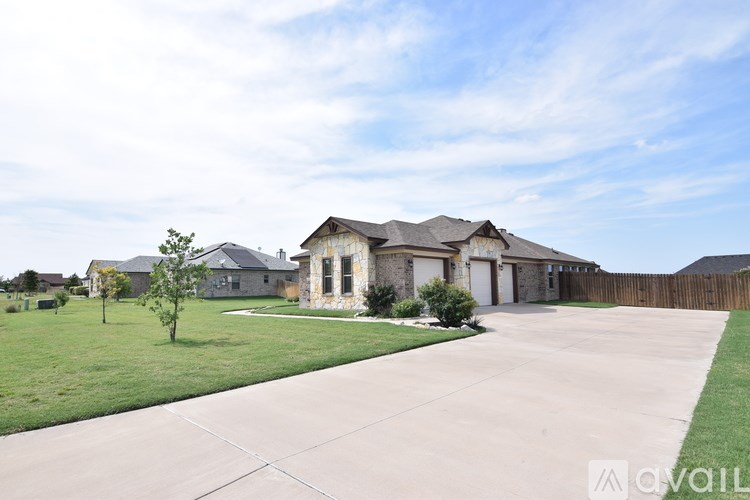 A house with a driveway in front of it.