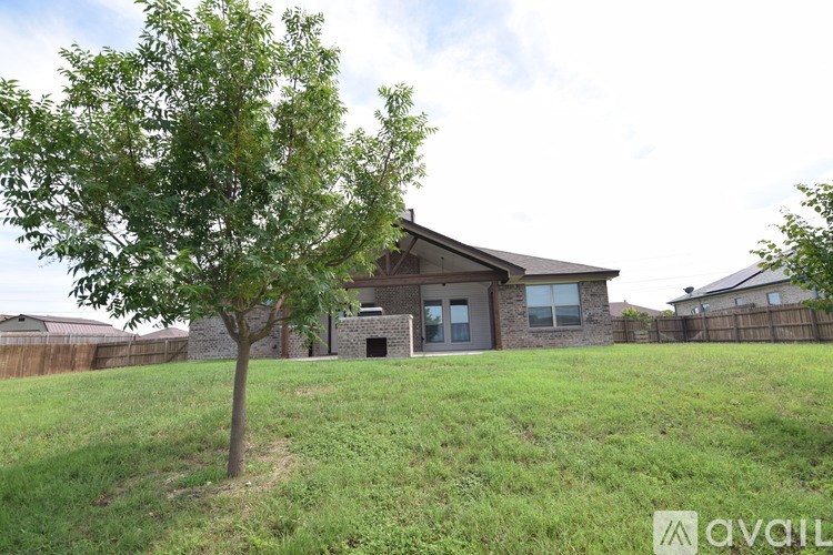 A house with a tree in front of it.