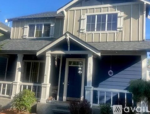 A house with a blue door and a porch.