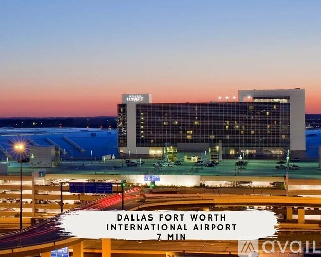 A view of the Dallas Fort Worth International Airport with a hotel in the background.