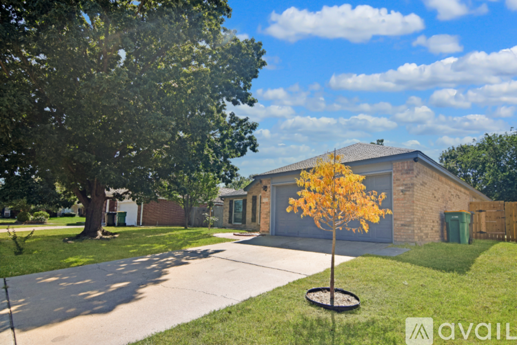 A house with a tree in front of it.
