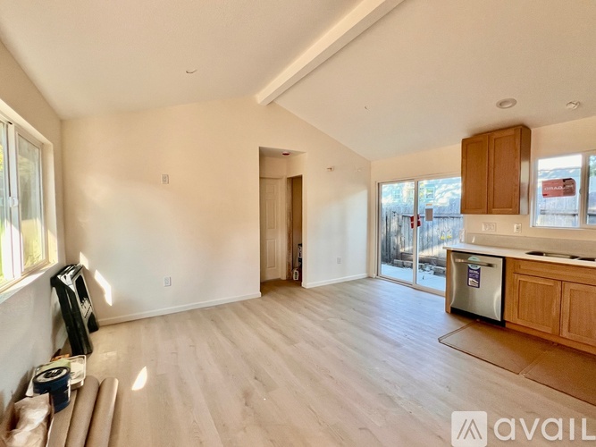 A floor plan of a house with a kitchen, living room, and two bedrooms.