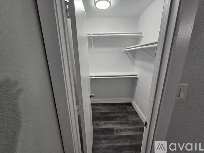 A small, empty room with a staircase leading to the next level.