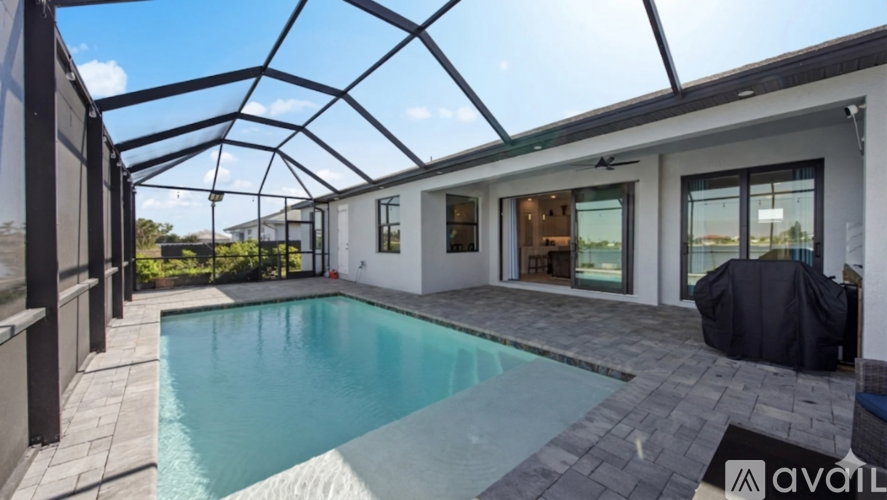 A modern house with a pool and glass ceiling.