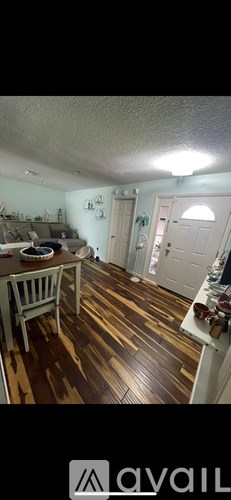 A room with wooden floors and a white ceiling.