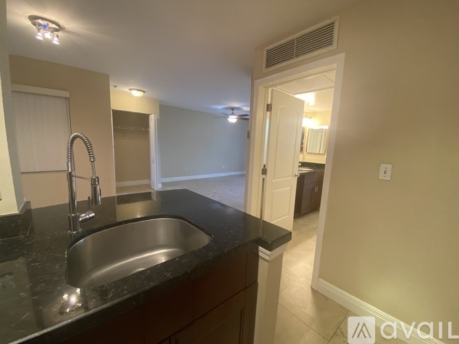 A kitchen with a sink and a countertop.