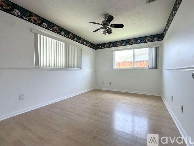 A two-story house with a garage is for sale.