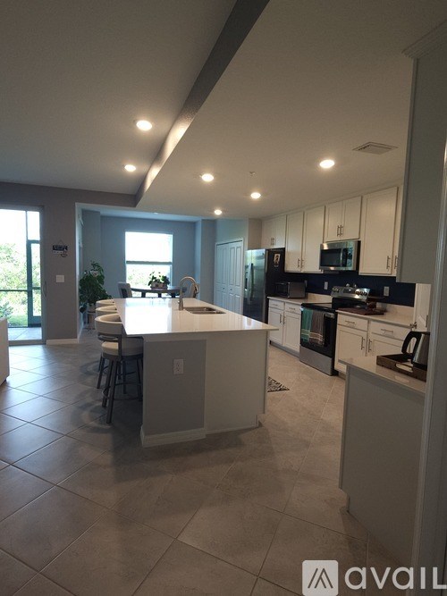 A modern kitchen with a large island in the middle.